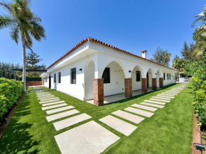 Villa Maspalomas Deluxe | Luxury Retreat in Gran Canaria | Private Heated Pool | Poolside Kitchen & BBQ Facilities | Golf Course View | Minutes from Stunning Maspalomas Dunes and Beaches | Maspalomas